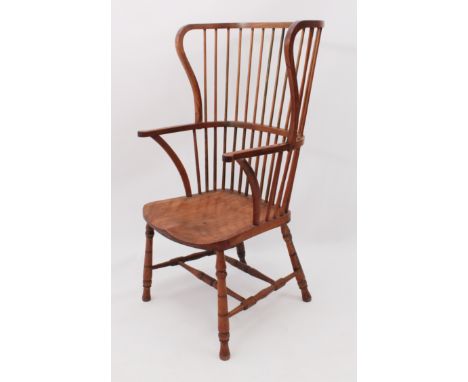 An unusual high wing-back 19th century Windsor chair - beech and ash, the high comb-back with wings to the sides, over straig