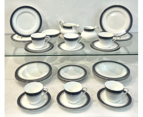 A Royal Doulton Sherbrooke pattern part-dinner service - including two vegetable dishes, one with cover; a 44.7cm oval platte