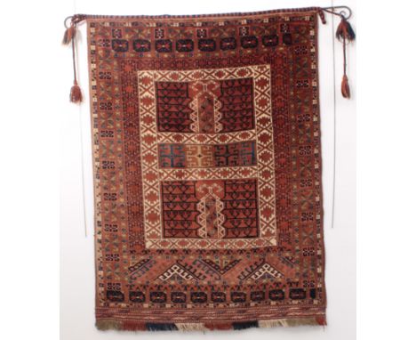 A Turkmen Hatchlu rug - probably mid-20th century, the quartered madder field with ivory borders and candlestick motifs, with