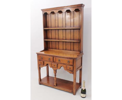 A small 18th century style light oak potboard dresser - mid-20th&nbsp;century, the closed plate rack with a moulded cornice o