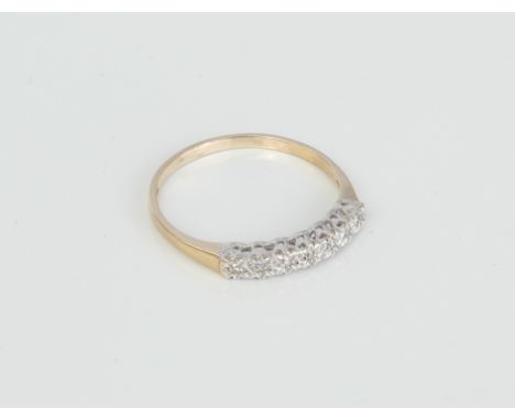 A 9ct gold and diamond 7 stone illusion set half eternity ring - London hallmarks, size Q.