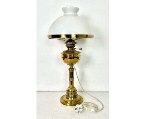 A large brass oil lamp with electric light conversion - signed 'Lampe Veritas' to the wick adjuster, with later electric lamp
