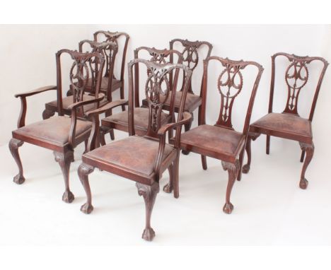 A set of eight Chippendale-style carved walnut dining chairs - including a pair of carvers, the backs carved with foliage, hu