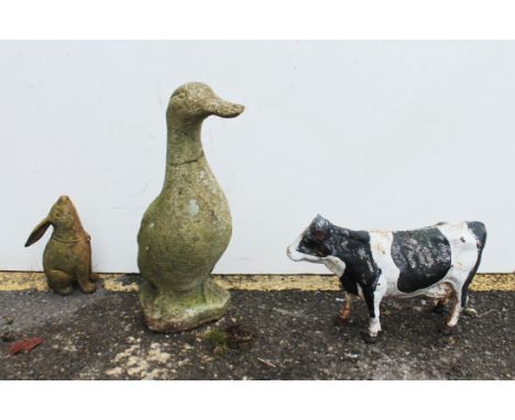 Three garden ornaments - a&nbsp;reconstituted-stone duck and a leveret, and a painted cast-iron dairy cow (21cm high)