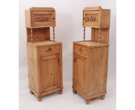 A pair of French pine bedside cupboards - early 20th century, with raised cupboard backs on bobbin turned supports, over a ba