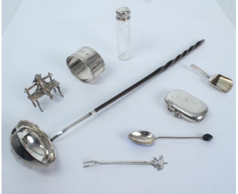 Seven small pieces of silver to include a vesta case, a napkin ring, a Georgian toddy ladle, a 19th century caddy spoon, a si