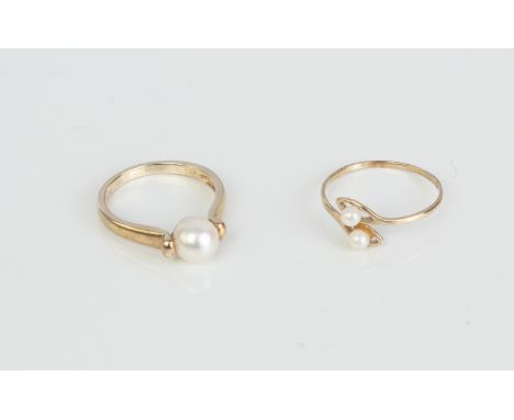 Two 9ct gold and cultured pearl rings - one with London hallmarks, with a single 6.5mm pearl, size L/M; the other a twist rin