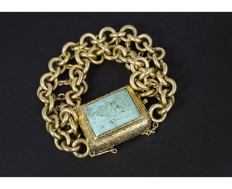 An antique Russian gold and turquoise bracelet, the central gold clasp of cushioned shape and engraved design, centred with a