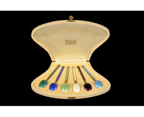 A set of Art Deco silver and enamel coffee spoons by David Andersen, presented in a Harrod’s fitted case, together with a set