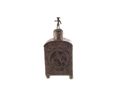A late 19th century Low Countries silver tea cannister, the caddy with embossed rococo motifs having panel to front with coat