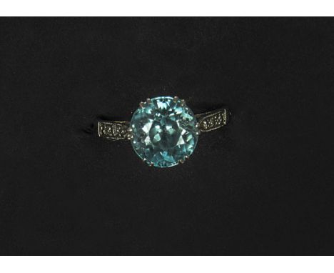 ANNOUNCE NOT AQUA ITS ZIRCO
A platinum Aquamarine solitaire dress ring, with shoulder mounted chip diamonds, size K 3.8g gros