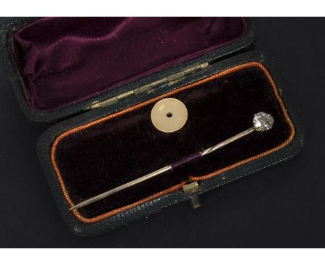 An Edwardian diamond stick pin, presented in a fitted case with an 18ct gold dress stud mount, the stick pin with screw fitti