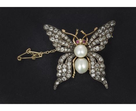 A diamond, ruby and pearl butterfly brooch, the old cuts in channel settings, with cabuchon ruby eyes and two pearl abdomen a
