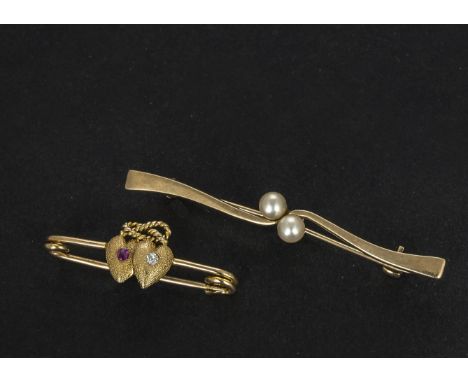 A 15ct gold ruby and diamond double heart bar brooch, together with a bar brooch set with two pearls (2) 