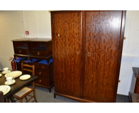 A Stag bedroom suite comprising, dressing table, chest of drawers, wardrobe, bed side chests; etc 