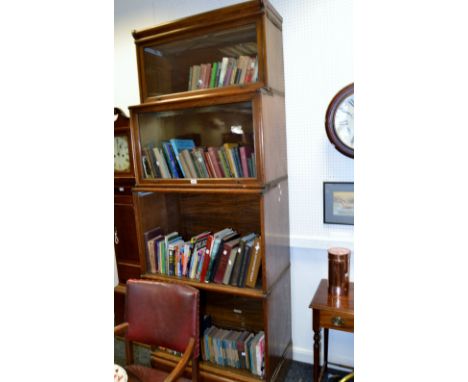 An oak Globe Wernike bookcase, four graduating sections 