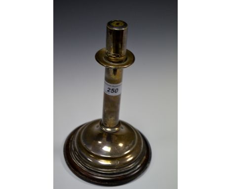 An Aesthetic Movement silver candlestick, in the manner of Dr Christopher Dresser, bayonet-fitting sconce, sprung ejecting me