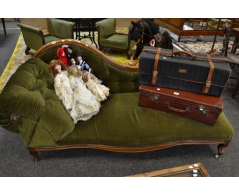A Victorian mahogany chaise, shaped back rail, deep button upholstered in green velvet, scrolling arm and back, serpentine ap