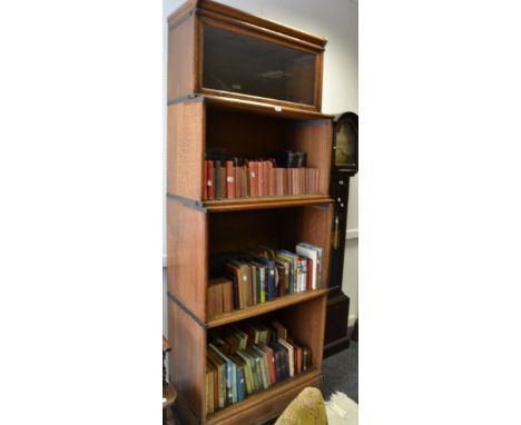 An oak Globe Wernike bookcase, four graduating sections 