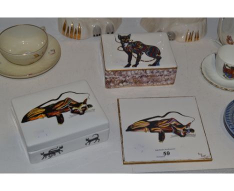 A porcelain and enamelled box painted with a stylised cat; another, a ceramic tile hand painted in enamel with a pensive cat 