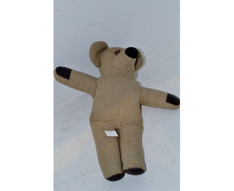 A stuffed bear, button eyes, 35.5cm long