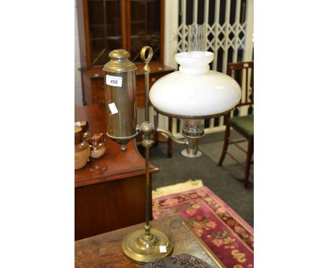 A 20th century brass oil lamp, white shade, 53cm high