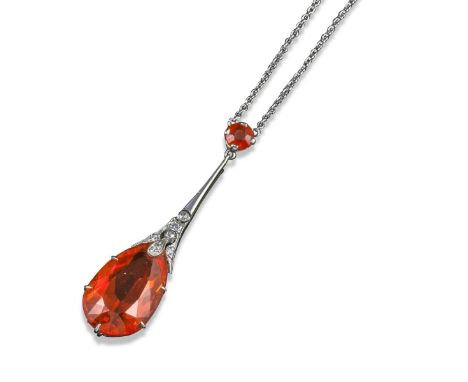 An early 20th century fire opal and diamond pendant, the pear-shaped fire opal suspends from a diamond-set white gold pendant