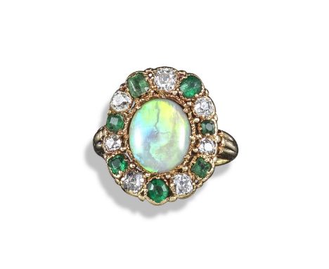 A 19th century opal, emerald and diamond cluster ring, set with an oval opal cabochon within a border of emeralds and diamond