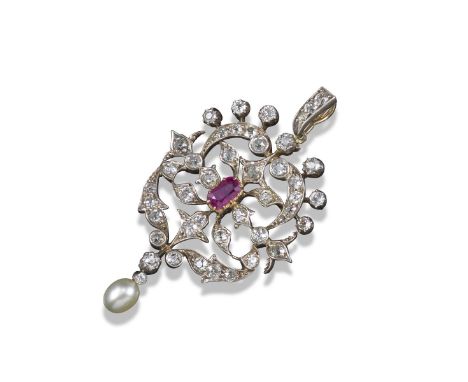 An Edwardian ruby and diamond-set pendant, of open floral design and set overall with graduated circular-cut diamonds, centre