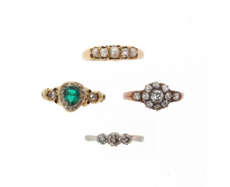 Four gem-set rings, including a Victorian pear-shaped emerald and diamond-set gold ring with pierced scroll shoulders, size N