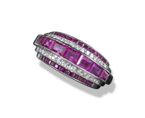 An Art Deco ruby and diamond ring, alternately-set with stepped lines of calibré-cut rubies and circular-cut diamonds in plat
