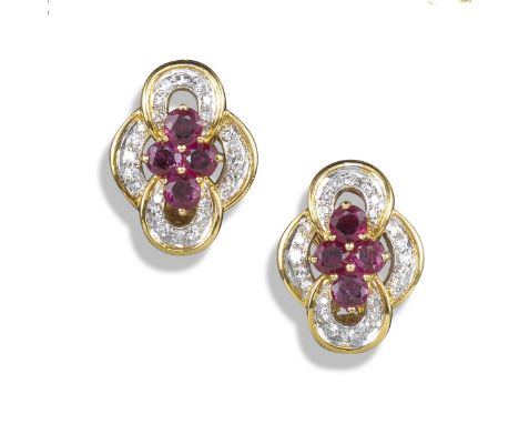 A pair of ruby and diamond earrings by Kutchinsky, of quatrefoil design set with a cluster of four rubies within diamond bord