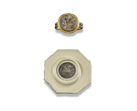 A carved mottled hardstone intaglio, probably Classical, the circular intaglio depicting a rampant griffin, 1.3cm wide, mount