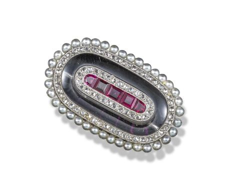 An early 20th century ruby and diamond brooch, the central section set with calibre-cut diamonds within concentric border of 