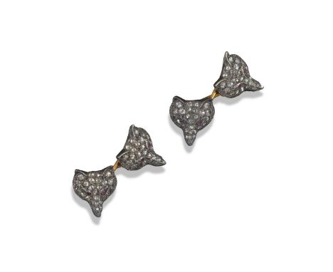 A pair of fox mask cufflinks, the four realistically formed silver and gold fox masks are pavé-set with rose-cut diamonds and
