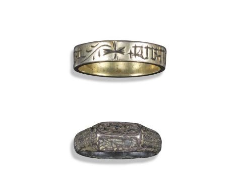 A gilt lined silver ring, engraved with black Lombardic script, size W, and a silver iconographic ring depicting Christian fi