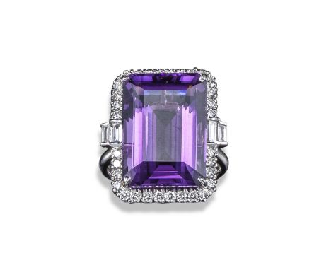 An amethyst and diamond cluster ring, the emerald-cut amethyst set within a surround of round brilliant-cut diamonds in white