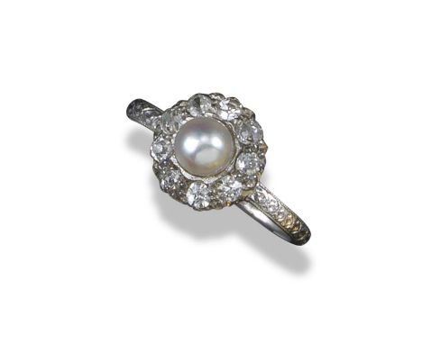 An Edwardian pearl and diamond cluster ring by Tiffany & Co, centred with a pearl within a border of old cushion-shaped diamo