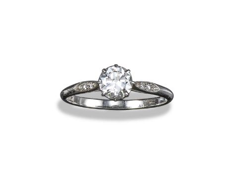 A diamond solitaire ring, the round brilliant-cut diamond weighs approximately 0.60cts, with two small circular-cut diamonds 