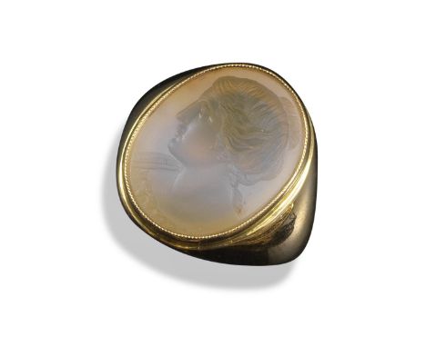 A chalcedony intaglio ring, depicting the profile of a woman in the classical manner in white chalcedony, in plain gold rub-o