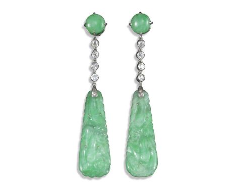 A pair of jade and diamond drop earrings, the carved jade panels suspend from an articulated line of diamonds and a circular 