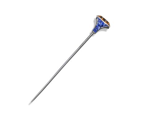 A yellow and blue sapphire nail head stick pin by Cartier, of stylised form, set in platinum and gold, signed and with maker'