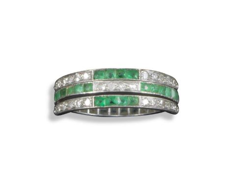 A double-hinged emerald and diamond-set swivel ring, alternately-set with rows of circular-cut diamonds and square-shaped eme