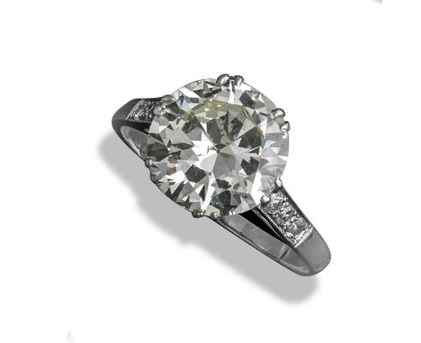 A diamond solitaire ring, the round brilliant-cut diamond weighs approximately 3.??? and is set in platinum, size P