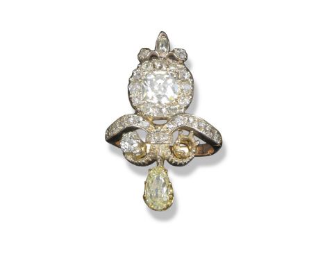 A diamond scroll ring, set with an old cushion-shaped diamond within a border of diamonds in silver and gold closed back sett