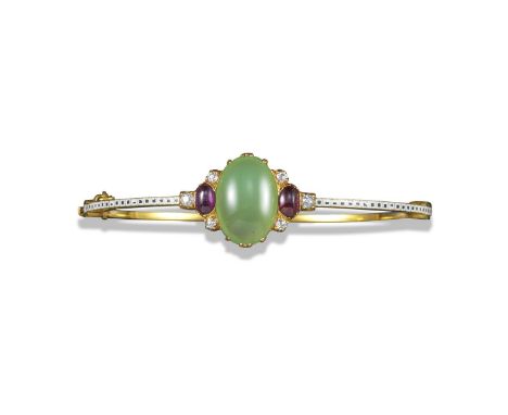 A gem-set gold hinged bangle by Giuliano, c1870, set with an oval-shaped chrysoprase cabochon with an oval-shaped ruby caboch
