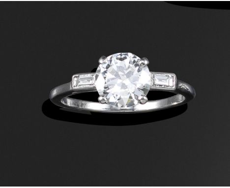 A diamond three-stone ring, the transitional-cut diamond weighs 1.20cts (known weight), flanked with baguette-shaped diamonds