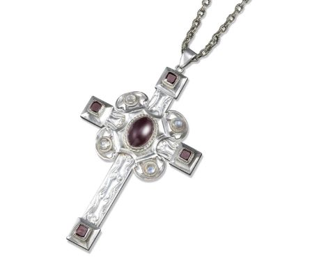 An Arts & Crafts stone-mounted silver Pectoral Cross, chased with foliate decoration and centred with an oval-shaped garnet c