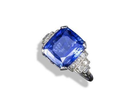 A sapphire and diamond ring, the cushion-shaped sapphire weighs approximately 8.50cts and is millegrain-set with two rows of 