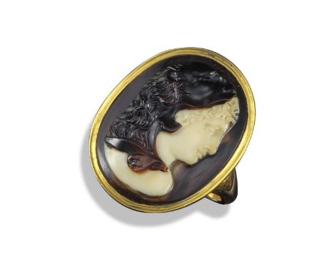 A late 18th/early 19th century carved two-colour hardstone cameo-mounted ring, the cameo depicting Omphale in profile wearing